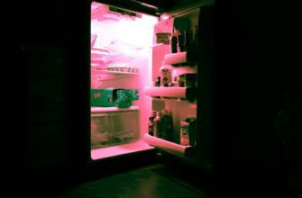 opened refrigerator filled with bottles