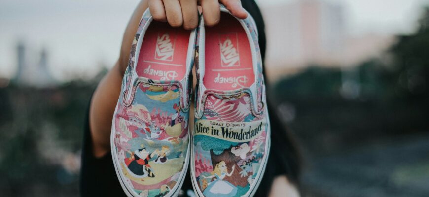 tilt shift lens photography of Vans Alice in Wonderland slip-on shoes