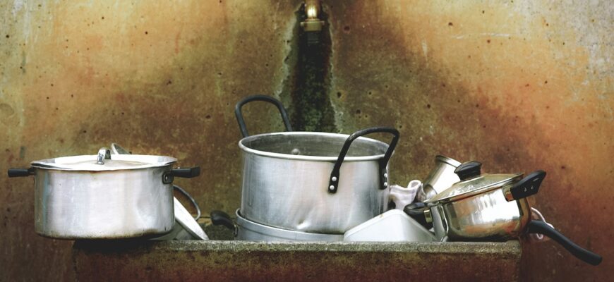 kitchen utensils on stone washing station